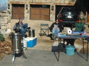John Cuckler Jr., left, and Peter Odiorne sit and monitor the turkeys as they deep fry — a Thanksgiving tradition at the Mountain Air County Club.