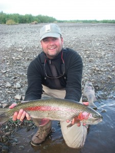 Geoff Roach holds a monster Kanektok "leopard" rainbow that took a foam mouse pattern.