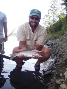 The author with a handsome Bow River rainbow that took a small caddis imitation.