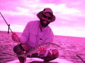 The author poses with a very average size bonefish from the flats around Andros Island.