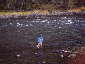 An angler on Oregon's Grande Ronde River unleashes a long cast with a spey rod.