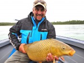 Kirk Deeter holds a fine carp landed on the fly.