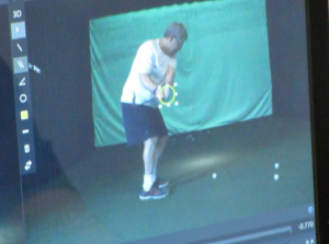 The clubhead, once off the screen, is now working right behind the hands.