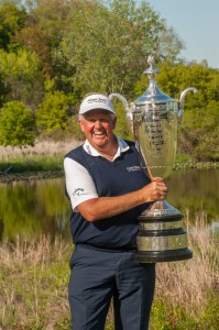 Montgomerie enjoys the moment with the Alfred S. Bourne Trophy after winning the 75th Senior PGA Championship.