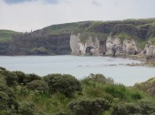 The white cliffs, right, and the Dunluce Castle, left, provide the view from the far side of Royal Portrush .