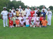 U.S. Navy Admiral Craig S. Faller surrounded by participating juniors and committee members during the MWGA Junior Golf Mentor Day, 2010.
