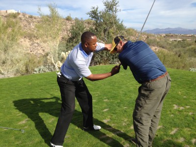 Receiving on-course instruction from McLean's Golf School Instructor Pomp Braswell, at the SunRidge Cayon Golf Club.