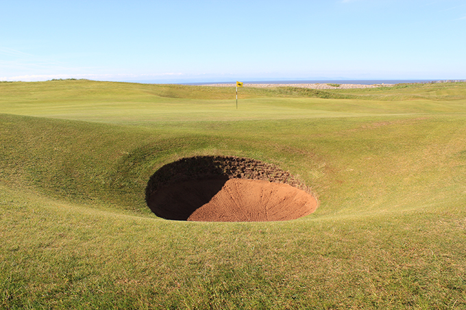 One of the many pot bunkers at Royal Porthcawl GC, this one protects the 4th green © James Mason