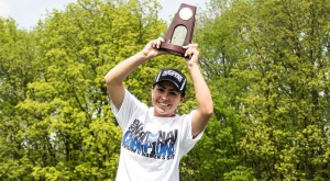 Brenna Moore lifts the trophy as a national champion