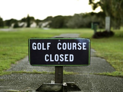 Golf Course Closed Sign on Street