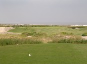 The great elevated green at The Ocean Course's par-3 14th falls away on all sides--a real obstacle in the ocean winds.