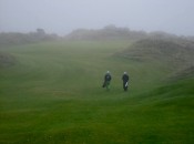 Into the gloaming: the walk into the first green at Bandon Trails, nestled between natural dunes.