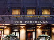The "Peninsula green" chauffer-driven Mini's stand ready for suite guests of The Peninsula Hotel in Chicago.