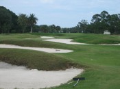 The drive at the short 16th must either fly or flank these bunkers.