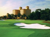 Team Norman's sharp-cut bunkers before the stately Ritz-Carlton.