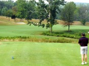 A golfer contemplates the safe and heroic lines on No. 9 at Whiskey Creek