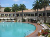 Pelican Hill's Pool in a Roman coliseum is high above the canyons fronting the Pacific below.       Photo Credit: Harrison Shiels