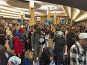 A sea of people swarmed the smashed Spirit gates at LAX. 
Photo by: Harrison Shiels