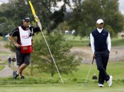 Tiger Woods and his new caddie Joe LaCavaon one the second green of the Frys.com Open.  AP Photo by Dino Voumas