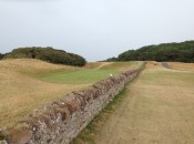 An ancient stonewall is a perfectly natural hazard at North Berwick