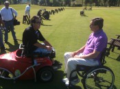 Dr. Michael Jacuch, right, learning about the benefits of the ParaGolfer from Jerry Donovan.